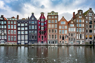 View of buildings against cloudy sky