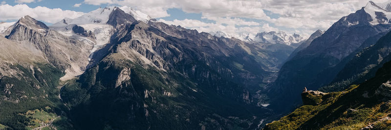 Panoramic view of snowcapped mountains against sky