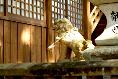 Low angle view of statue against building