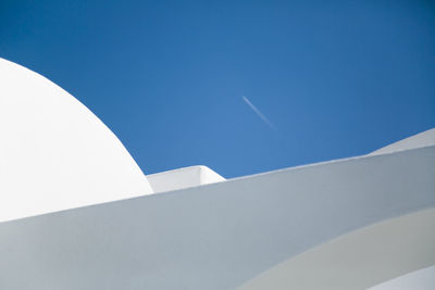 Low angle view of building against clear blue sky