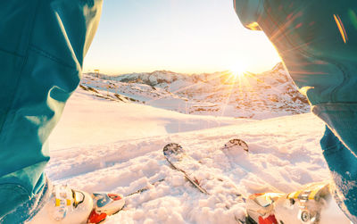 Low section of people on snow covered field