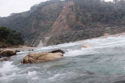 Scenic view of sea against mountain