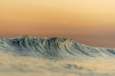 Scenic view of desert against sky during sunset