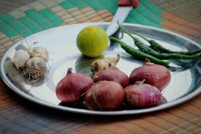 Close-up of fruits in plate on table