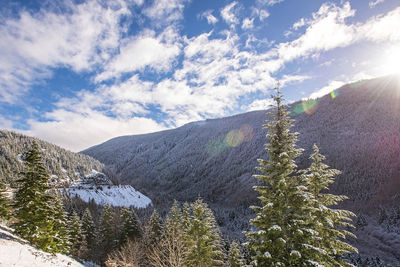 Scenic view of snowcapped mountains against sky