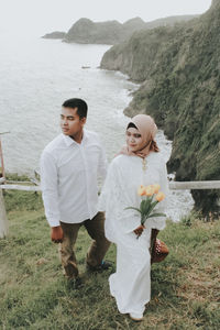 Young couple standing on land