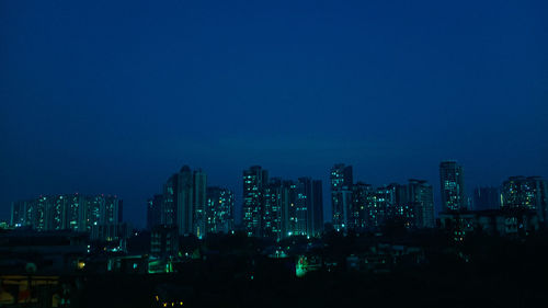 Illuminated buildings in city at night