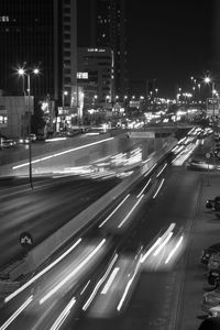 Light trails on road in city at night