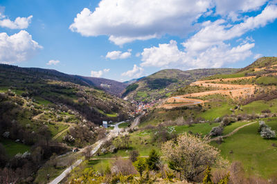 Scenic view of landscape and mountains against sky