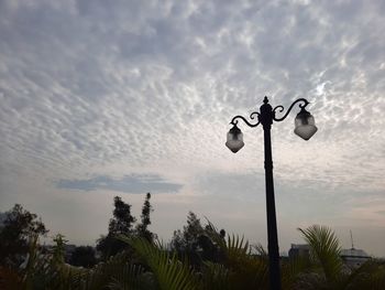 Low angle view of street light against sky