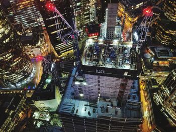 Illuminated building in city at night