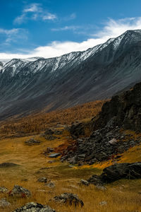 Scenic view of snowcapped mountains against sky