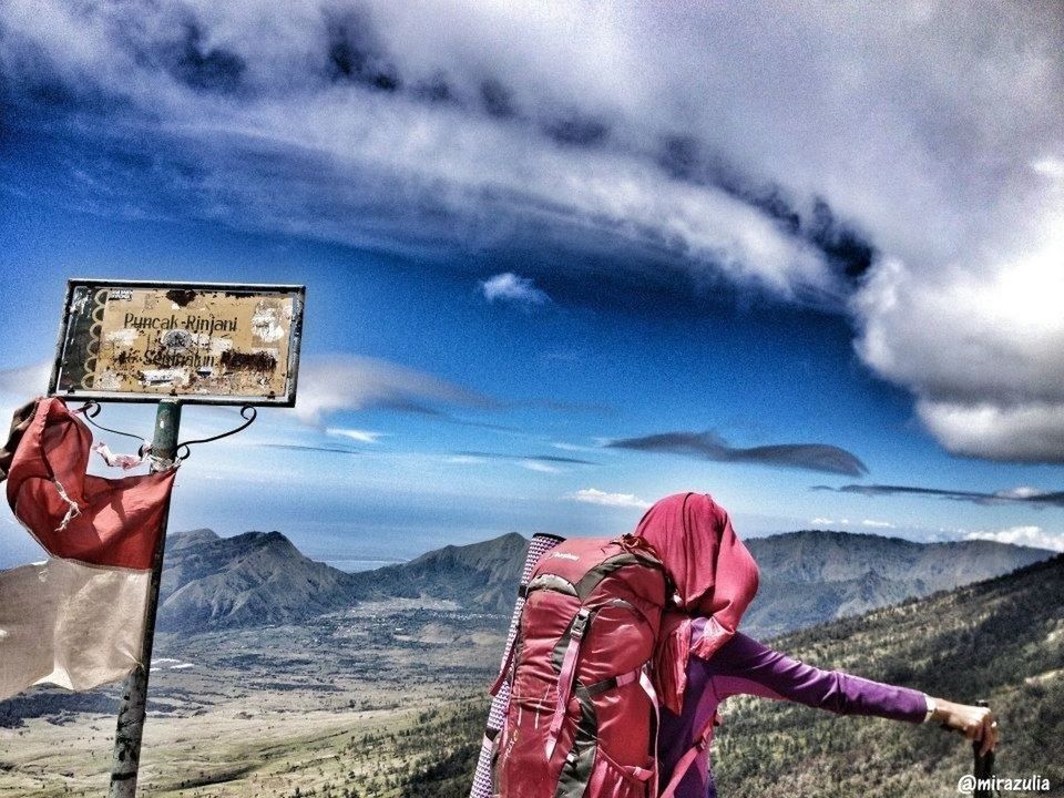 sky, mountain, cloud - sky, cloud, landscape, cloudy, red, lifestyles, mountain range, leisure activity, holding, standing, nature, day, outdoors, tranquil scene, scenics, tranquility