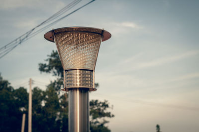 Low angle view of street light against sky