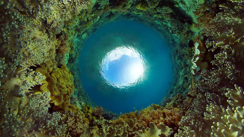 Scenic view of sea seen through hole