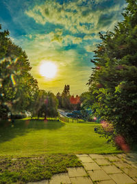 Scenic view of park against sky during sunset