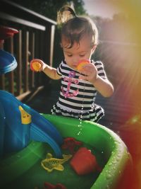 Cute boy playing with toy