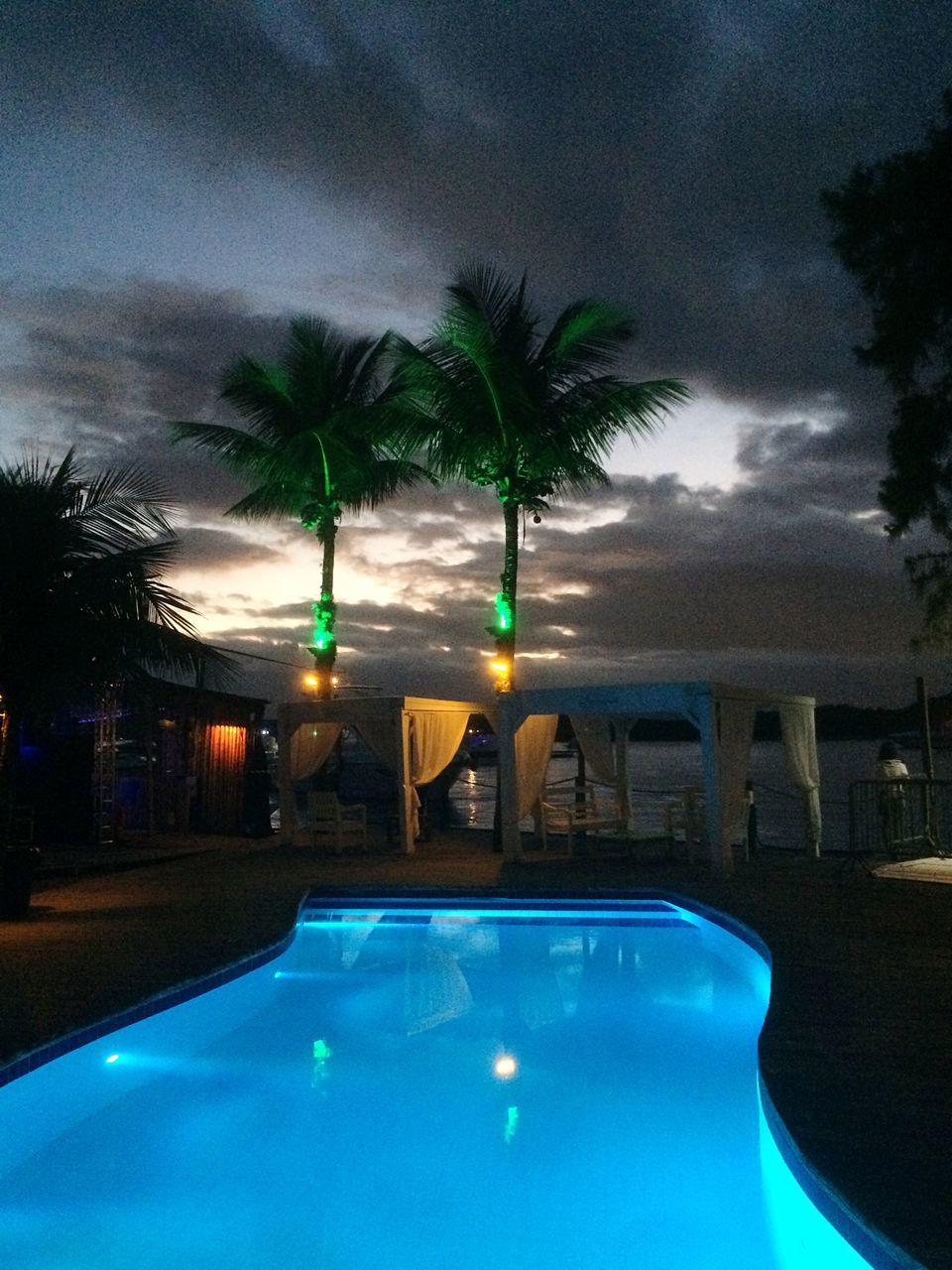 swimming pool, palm tree, chair, water, tree, luxury, vacations, sunset, no people, illuminated, outdoors, sky, day