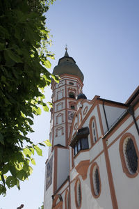 Low angle view of bell tower against clear sky