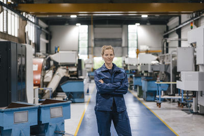 Young woman working as a skilled worker in a high tech company, portrait