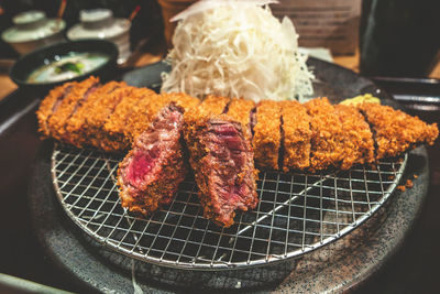 Close-up of meat on barbecue grill