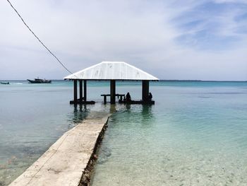 Pier on sea against sky