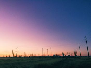 Scenic view of field against sky at sunset