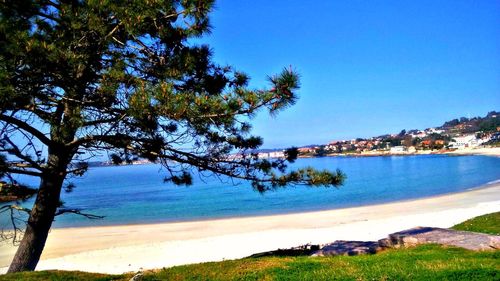 Scenic view of sea against clear blue sky