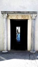 Man in front of built structure