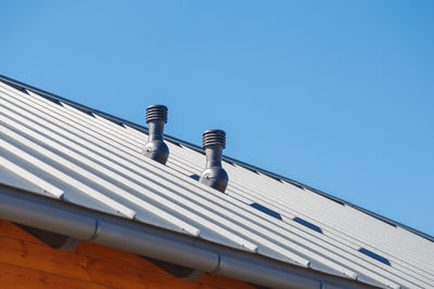 Low angle view of building against clear blue sky