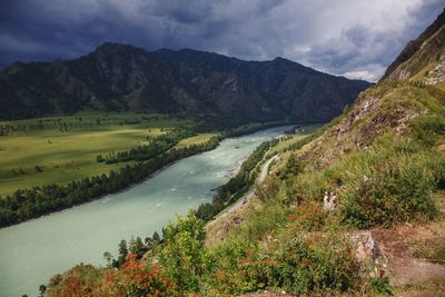 Scenic view of landscape and mountains against sky