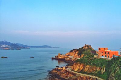 Scenic view of sea against blue sky