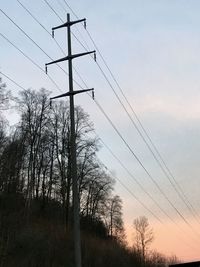 Low angle view of silhouette trees against sky during sunset