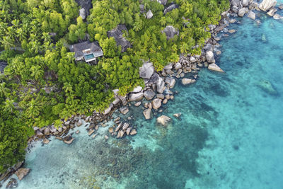 High angle view of rocks by sea