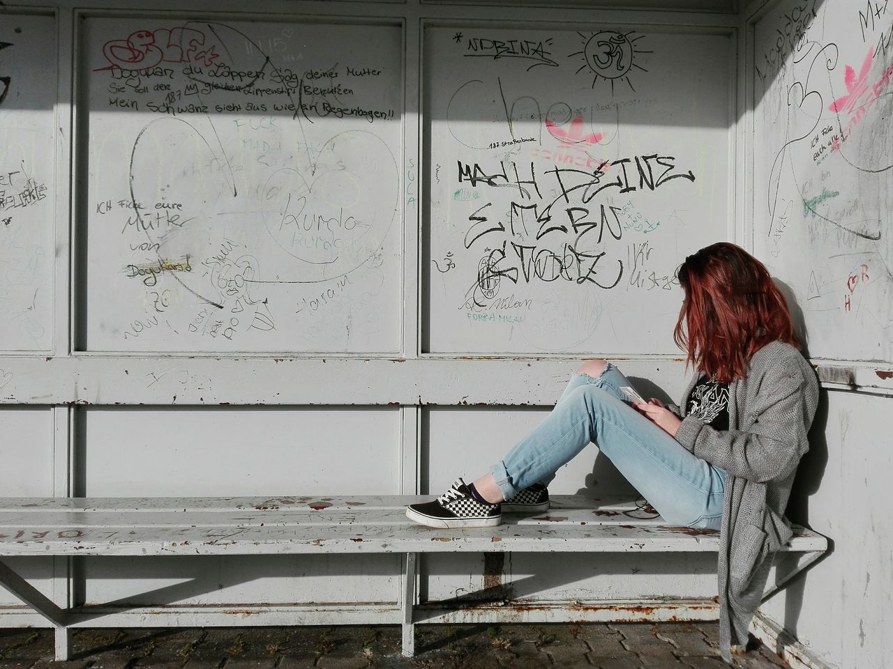 WOMAN SITTING ON A TABLE