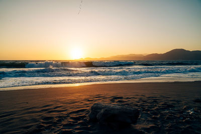 Scenic view of sea against sky during sunset