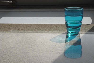 Close-up of blue water on table