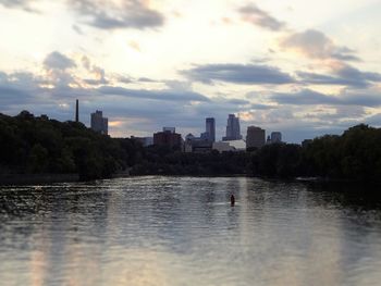 Scenic view of cityscape against sky during sunset
