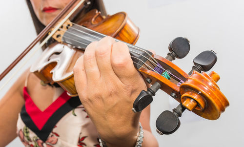 Close-up of man playing the guitar