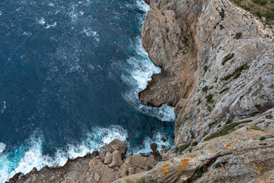 High angle view of rock formation in sea