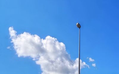 Low angle view of street light against sky