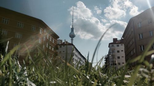 Buildings against cloudy sky