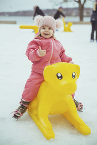 Cute kid riding a sled