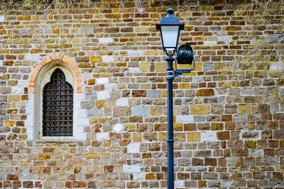 Gas light against old building