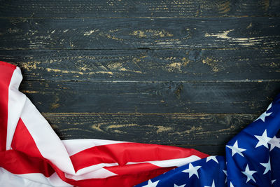 Close-up of flag against blue wall