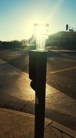 Close-up of water in city against sky