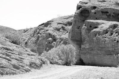 Rock formations on mountain against sky