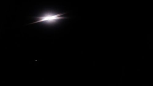 Low angle view of moon in sky at night