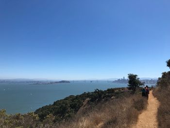 Scenic view of sea against clear blue sky