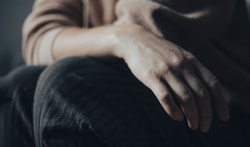 Woman's hand in pastel colors, minor emotional